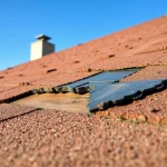 Inspecting spray foam roof damage to assess repair needs and solutions.